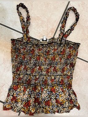 Multi-colored floral tank top with ruffled straps and elastic back